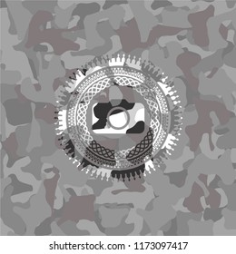 photo camera icon inside grey camo emblem
