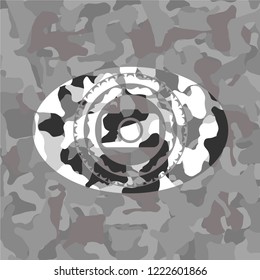 photo camera icon inside grey camouflage emblem