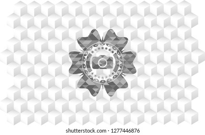 photo camera icon inside grey icon or emblem with geometric cube white background