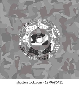 photo camera icon inside grey camo texture