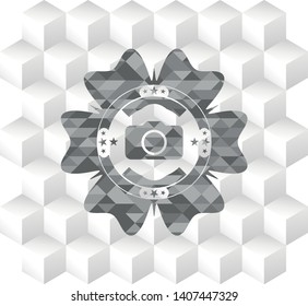 photo camera icon inside grey emblem with cube white background