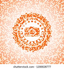 photo camera icon inside orange mosaic emblem