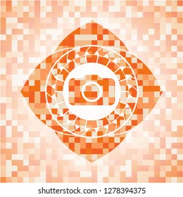 photo camera icon inside orange mosaic emblem