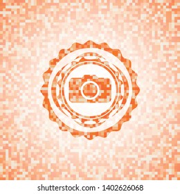 photo camera icon inside orange mosaic emblem