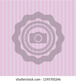 photo camera icon inside pink icon or emblem