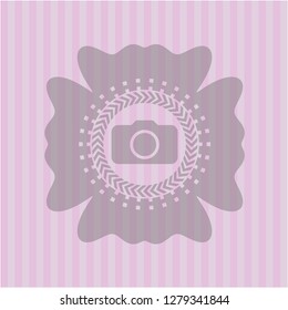 photo camera icon inside pink emblem. Retro