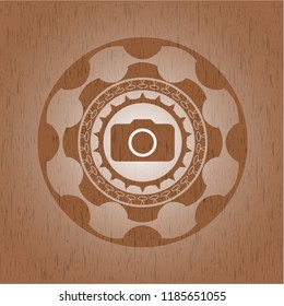 photo camera icon inside realistic wood emblem