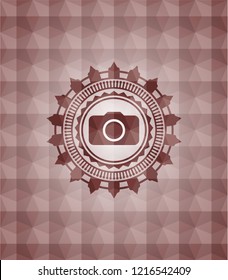photo camera icon inside red emblem or badge with abstract geometric pattern background. Seamless.
