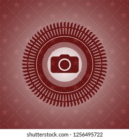 photo camera icon inside red emblem. Vintage.