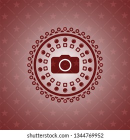 photo camera icon inside red icon or emblem