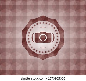photo camera icon inside red emblem or badge with abstract geometric polygonal pattern background. Seamless.