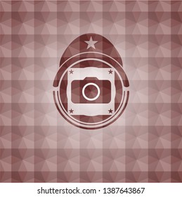 photo camera icon inside red emblem or badge with abstract geometric polygonal pattern background. Seamless.
