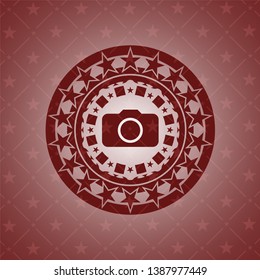 photo camera icon inside red icon or emblem