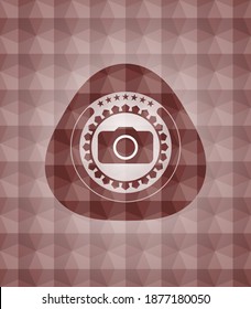 photo camera icon inside red emblem or badge with abstract geometric polygonal pattern background. Seamless. 