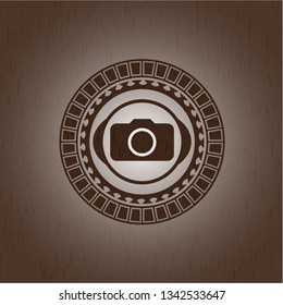 photo camera icon inside retro wooden emblem