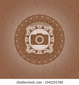 photo camera icon inside retro wooden emblem
