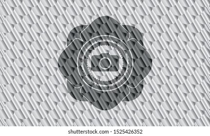 photo camera icon inside shiny silver emblem. Scales pattern. Vector Illustration. Detailed.
