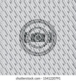 photo camera icon inside silver color badge. Scales pattern. Vector Illustration. Detailed.