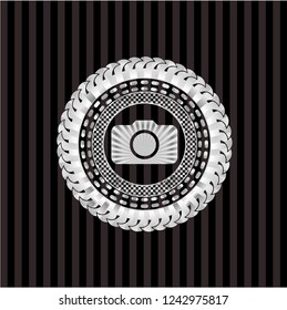 photo camera icon inside silvery badge or emblem