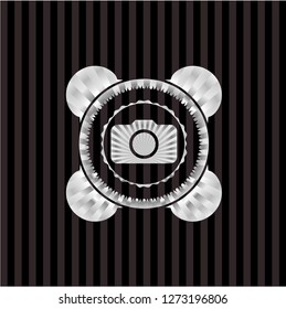 photo camera icon inside silvery emblem