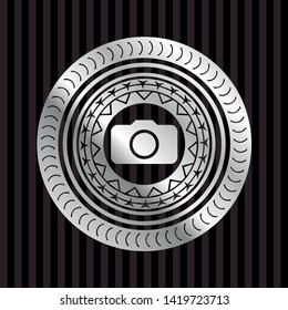 photo camera icon inside silvery emblem