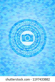 photo camera icon inside sky blue mosaic emblem