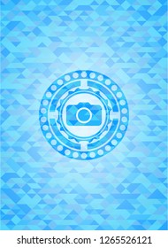 photo camera icon inside sky blue mosaic emblem