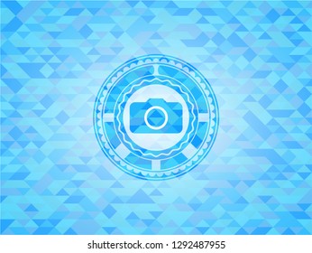 photo camera icon inside sky blue mosaic emblem