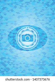 photo camera icon inside sky blue mosaic emblem