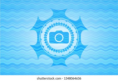 photo camera icon inside water wave concept emblem background.