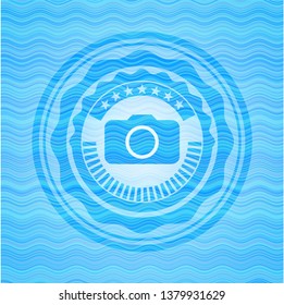 photo camera icon inside water representation emblem background.