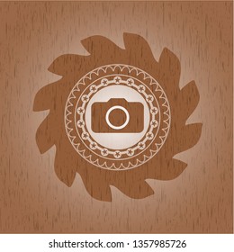 photo camera icon inside wooden emblem