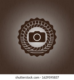photo camera icon inside wooden emblem. Retro