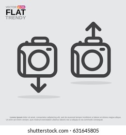 Photo camera icon or logo with arrow up and down.  Concept of uploading, downloading photos. Line image, monochrome and isolated on grey.