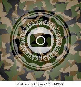 photo camera icon on camo pattern