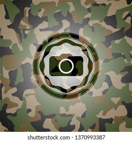 photo camera icon on camo pattern