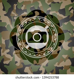 photo camera icon on camouflaged texture