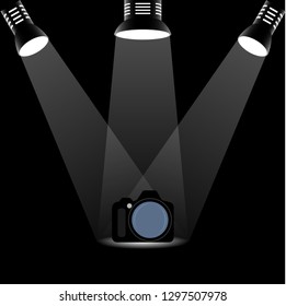 Photo camera illuminated by three searchlights