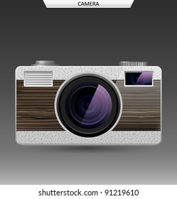 Photo camera with  lens. White version. Front panel is made of wood.