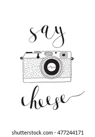 Photo camera with lettering - Say cheese. Vector hand drawn illustration.