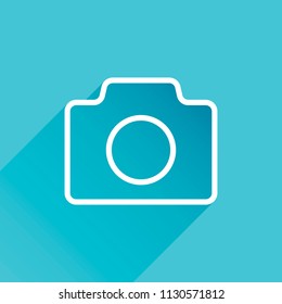 Photo camera, linear symbol with thin outline, simple icon. Gray icon with long shadow in bottom left corner on blue background