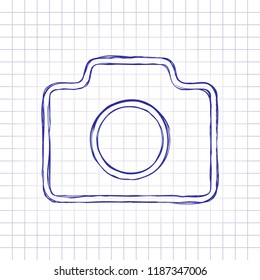 Photo camera, linear symbol with thin outline, simple icon. Hand drawn picture on paper sheet. Blue ink, outline sketch style. Doodle on checkered background