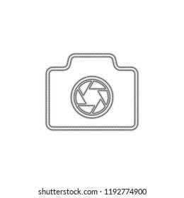 Photo camera, linear symbol with thin outline, simple icon. Dotted outline silhouette with shadow on white background