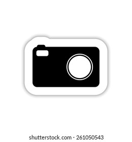 Photo camera on a white background with shadow