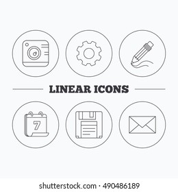 Photo camera, pencil and mail icons.