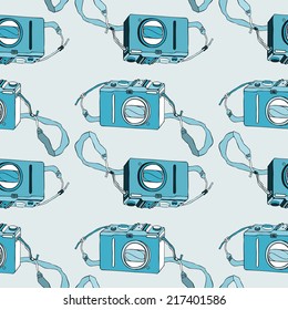 Photo camera. Retro seamless background. Hand drawn pattern.