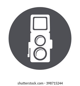 Photo camera retro.  Vector white illustration in black circle background.