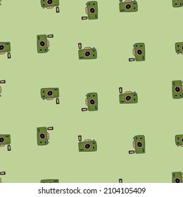 Photo camera seamless pattern. Cute vintage cameras background. Repeated texture in doodle style for fabric, wrapping paper, wallpaper, tissue. Vector illustration.
