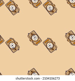 Photo camera seamless pattern. Cute vintage cameras background. Repeated texture in doodle style for fabric, wrapping paper, wallpaper, tissue. Vector illustration.