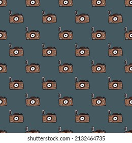 Photo camera seamless pattern. Cute vintage cameras background. Repeated texture in doodle style for fabric, wrapping paper, wallpaper, tissue. Vector illustration.